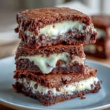 Cream Cheese Stuffed Brownie Mix Cookies with gooey centers and chocolate drizzle.  