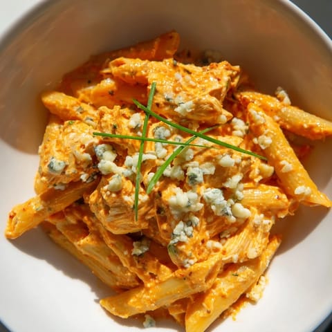 Spicy Buffalo Chicken Pasta featuring penne coated in a zesty buffalo sauce and melted mozzarella.