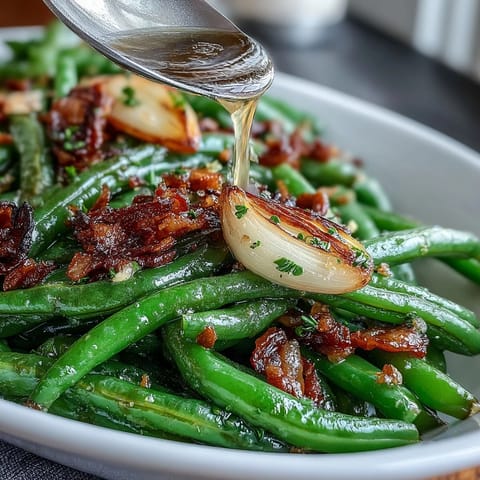 Roasted garlic green beans with caramelized garlic and lemon zest, a savory Easter side dish.  