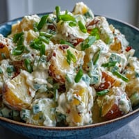 Creamy Juneteenth Soul Food Potato Salad with pickles and mustard, ready for summer picnics.
